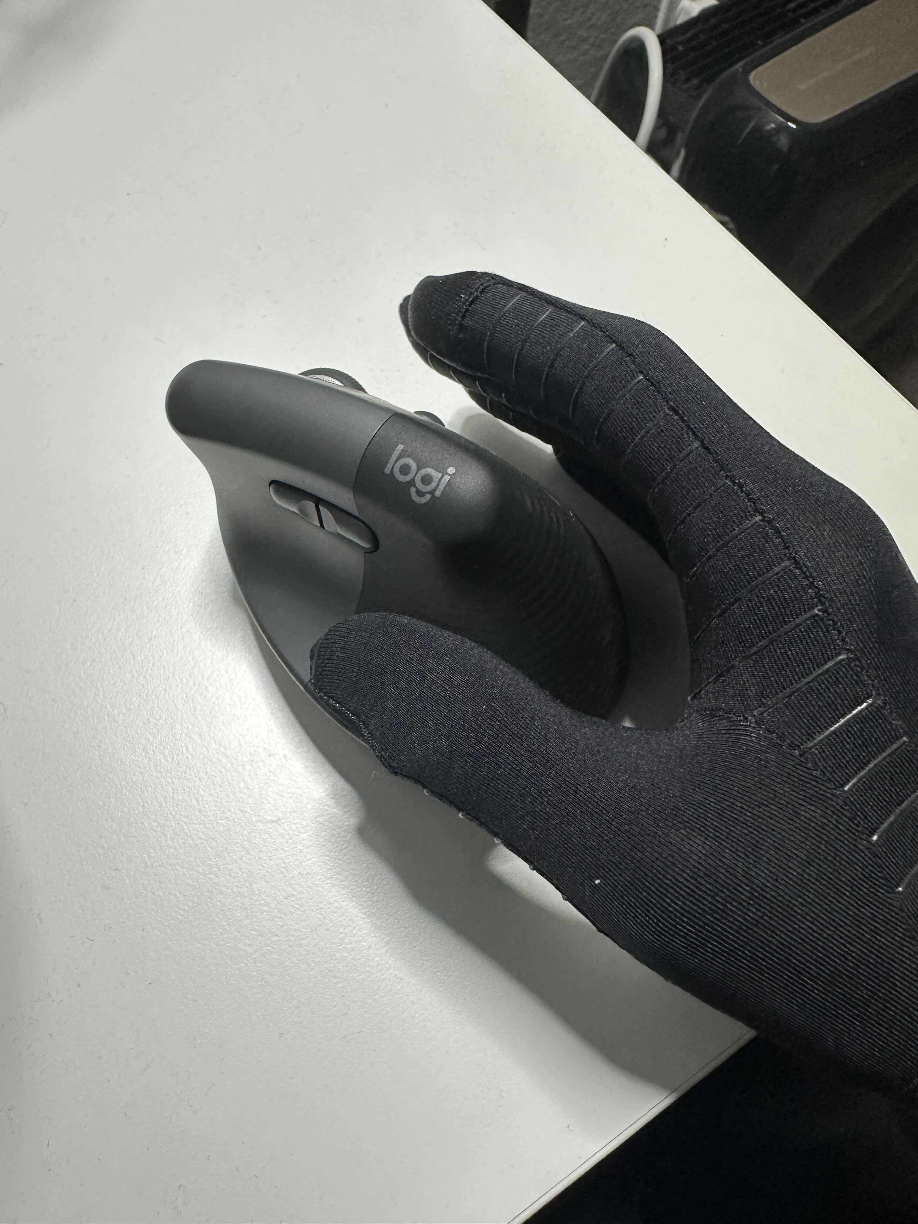 Logitech Lift looks like a droplet of water with a buttons rotates to the side of the droplet. It is a bit too small for my hands