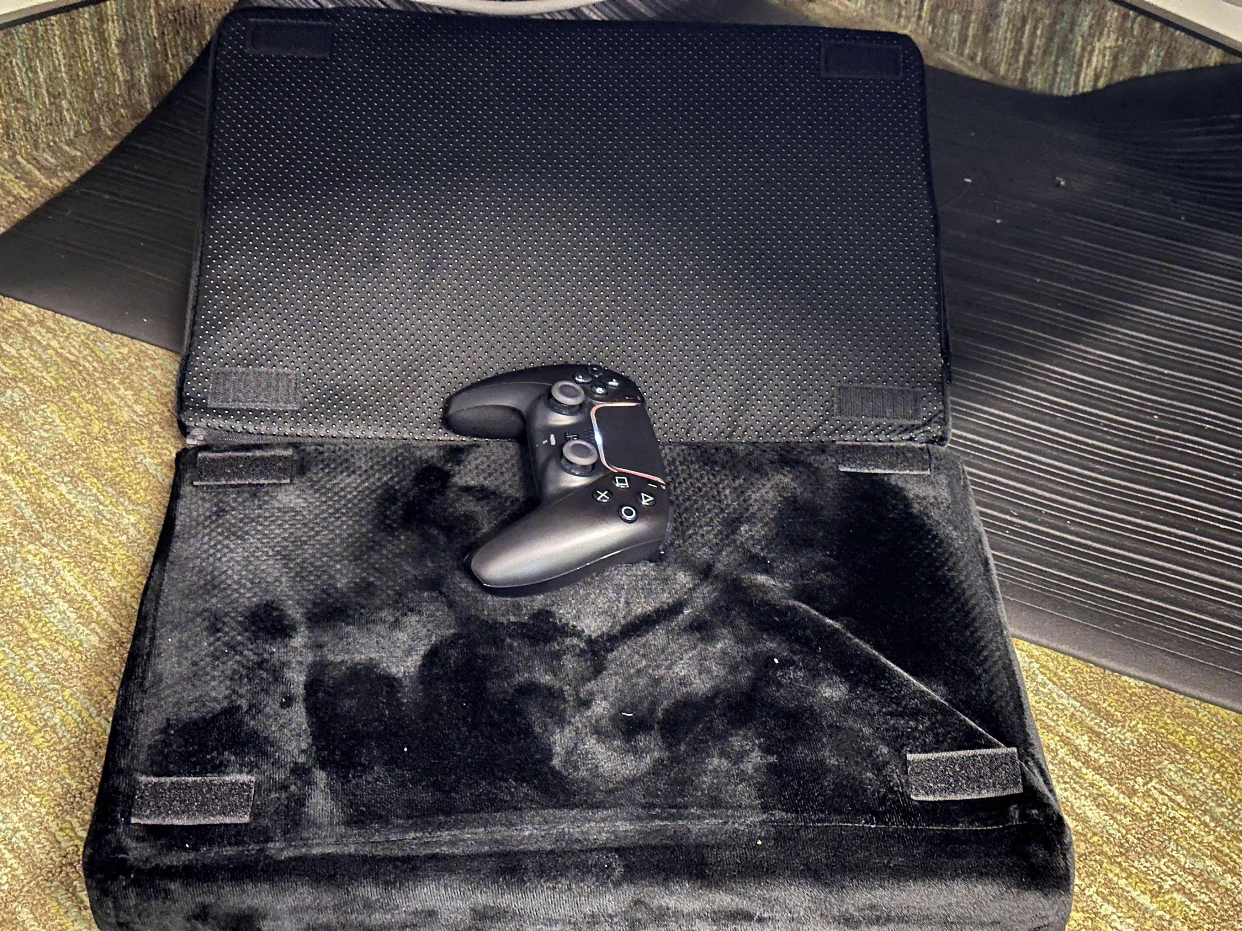 Gamepad on the floor works best when used with a foot rest so that you can adjust feet position better.