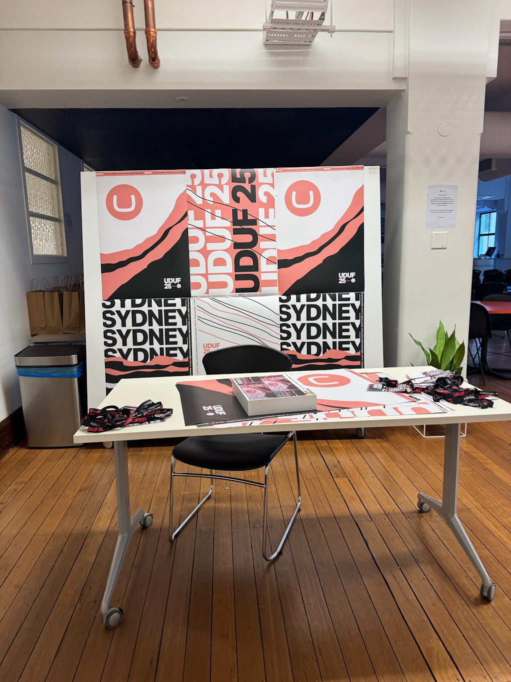 desk with Umbraco down under festival gear on it