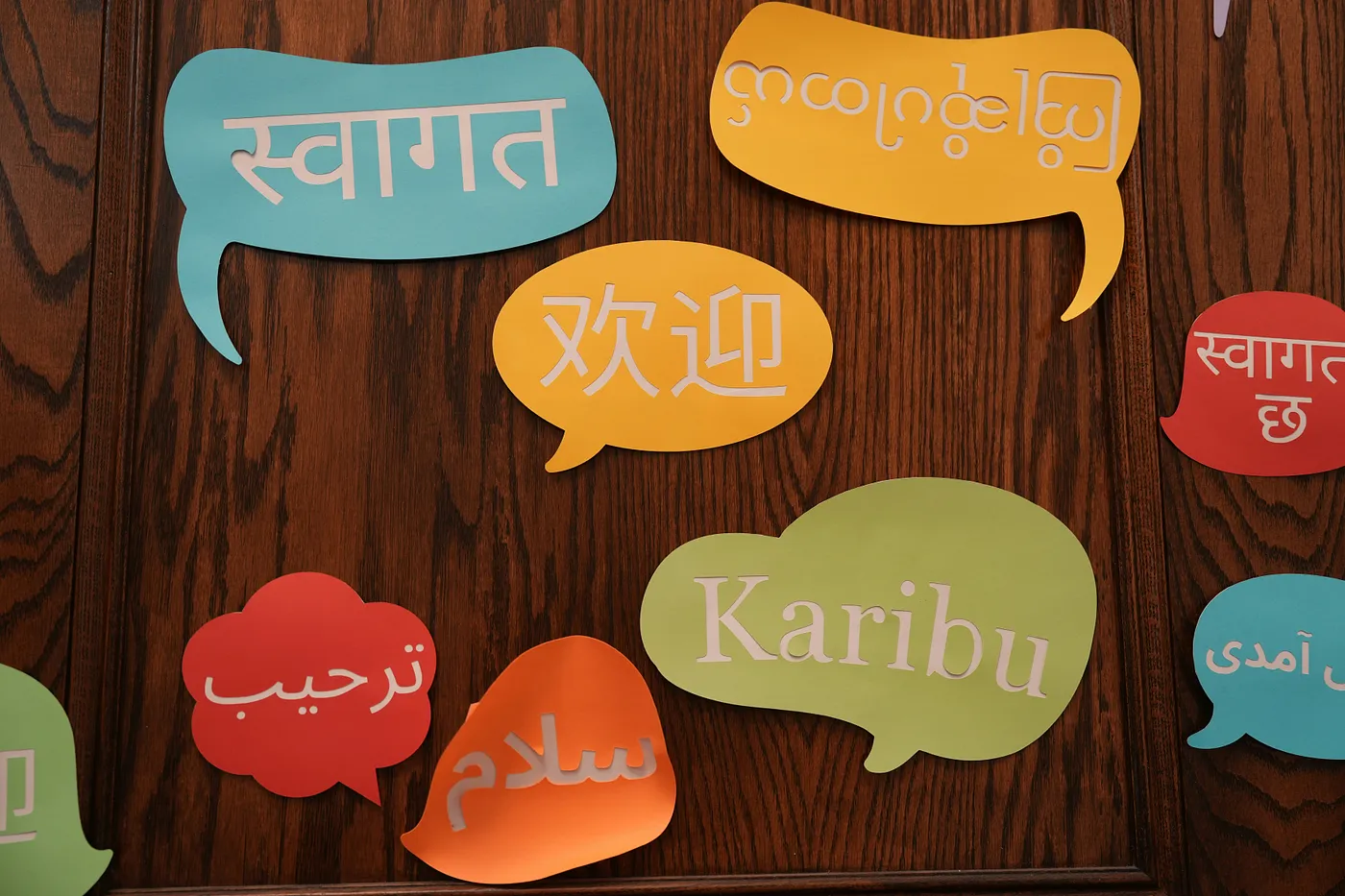 speech bubbles with text in diffeerent languages. Photo by zhendong wang on Unsplash