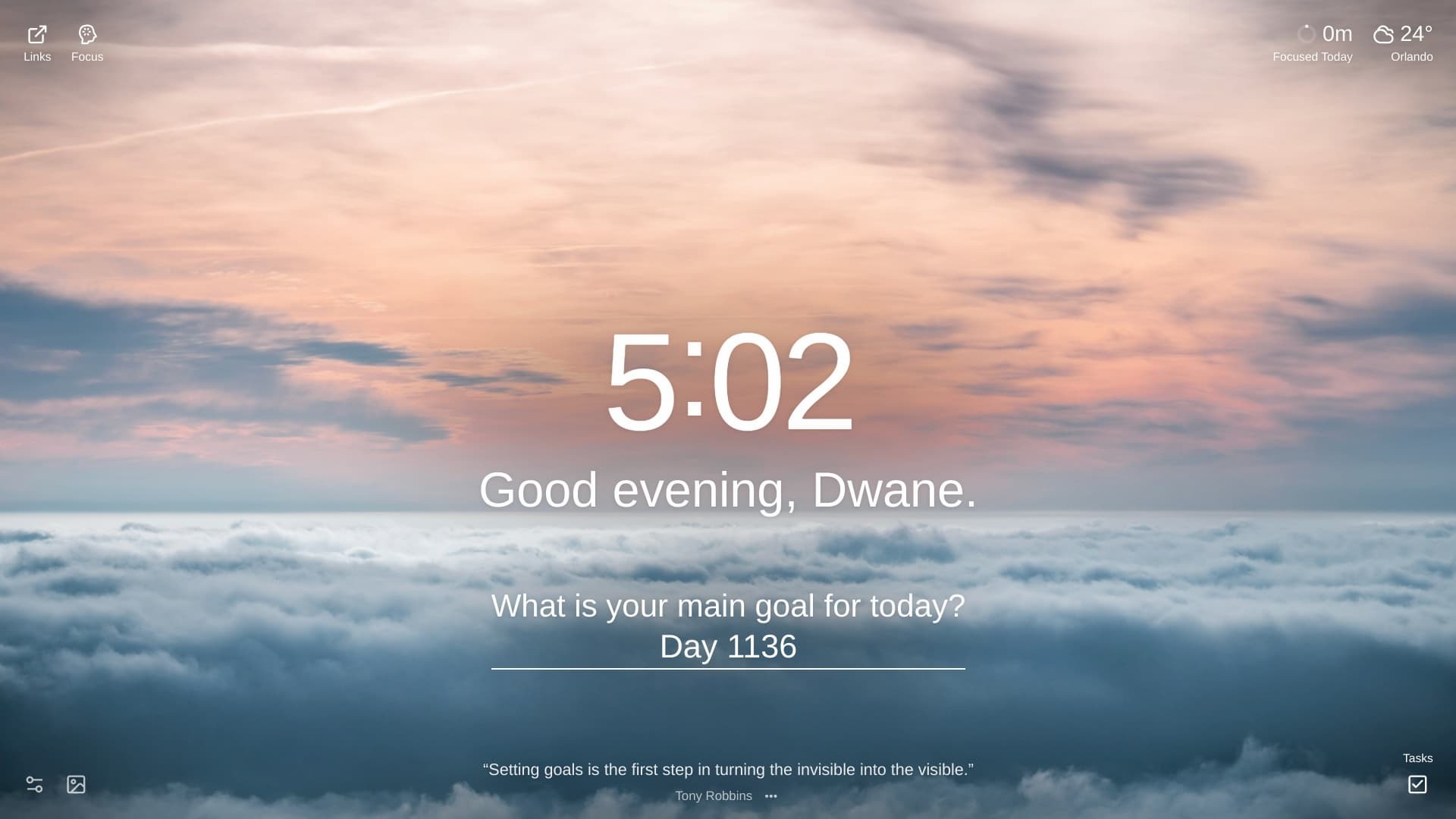 A serene skyscape at twilight, featuring a thick layer of white clouds stretching across the lower half of the frame, resembling a sea of fog. Above the clouds, the sky transitions from a soft peach and pink near the horizon to a pale blue with wispy gray clouds higher up. The location is  Above Zaly, Czechia.