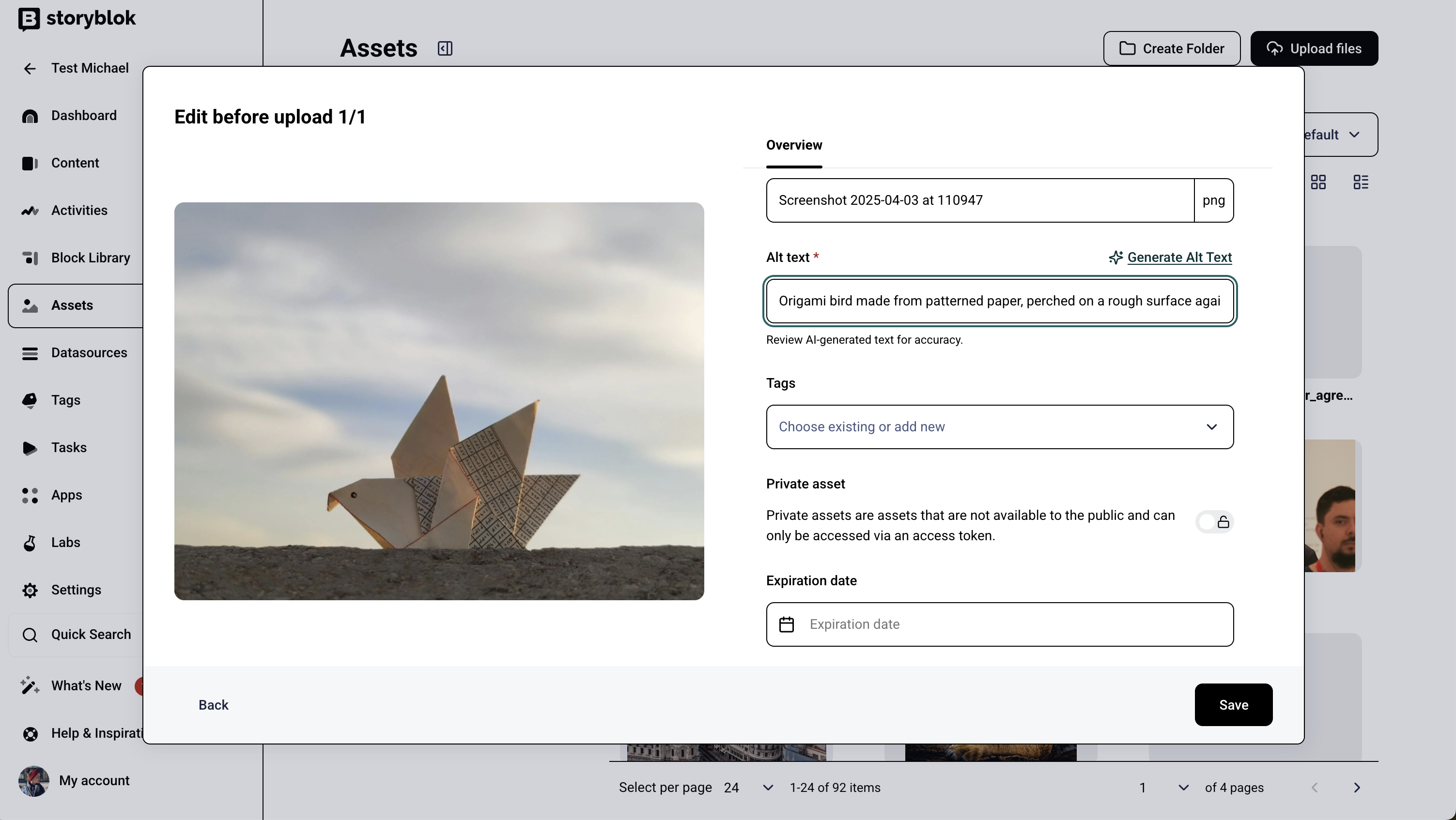 A screenshot of an asset upload page showing an origami bird photo with metadata fields for description, tags, and expiration date.