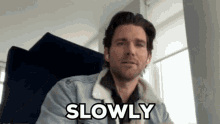 Funny gif of man gesturing slow it down