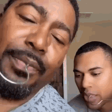 Funny Gif of man imitating a fish getting hooked