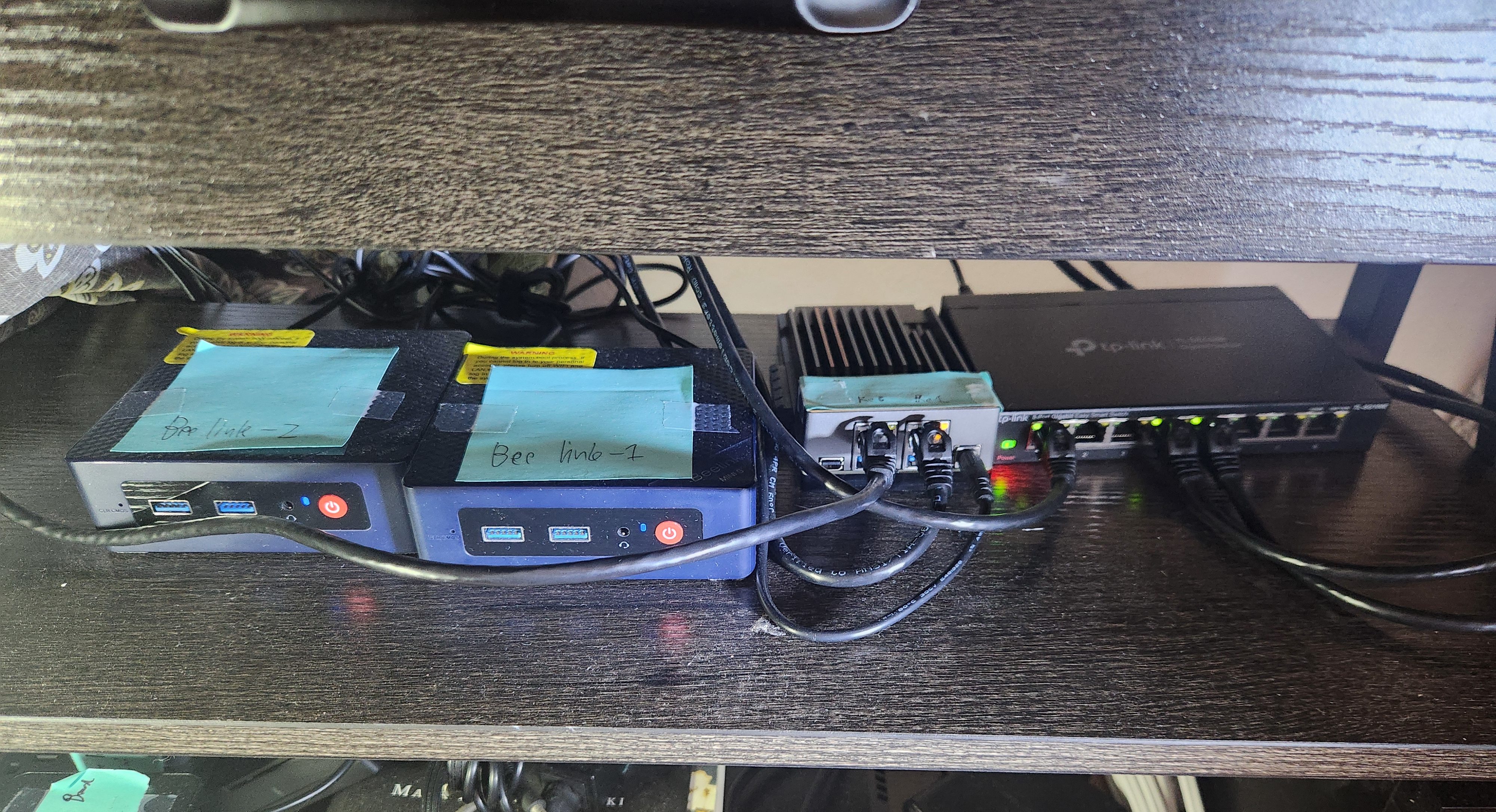 picture of the front of the ZimaBoard, switch, and the two Beelinks