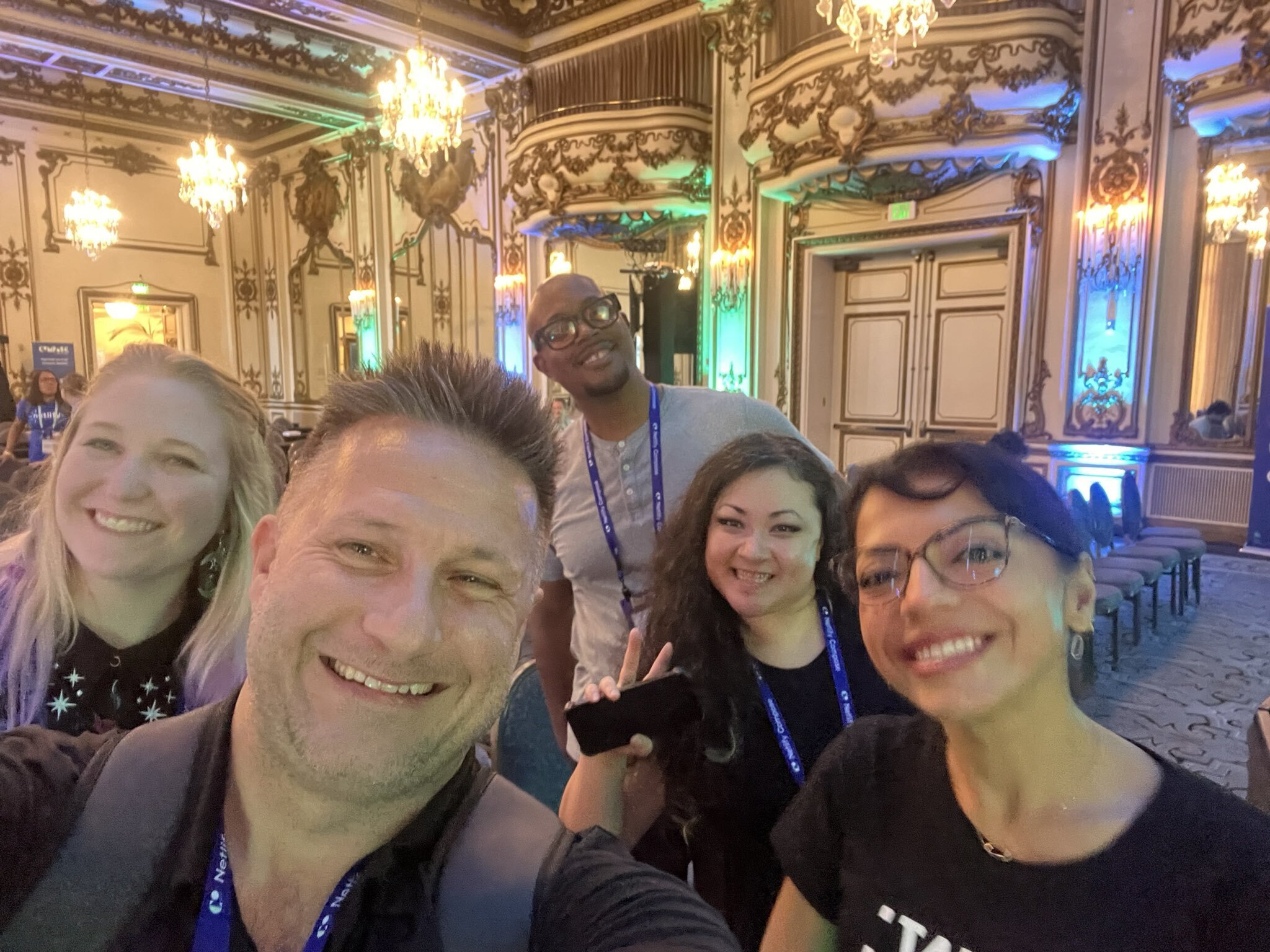 A selfie of Abbey and friends in the Fairmont San Francisco ballroom that Netlify Compose was held in