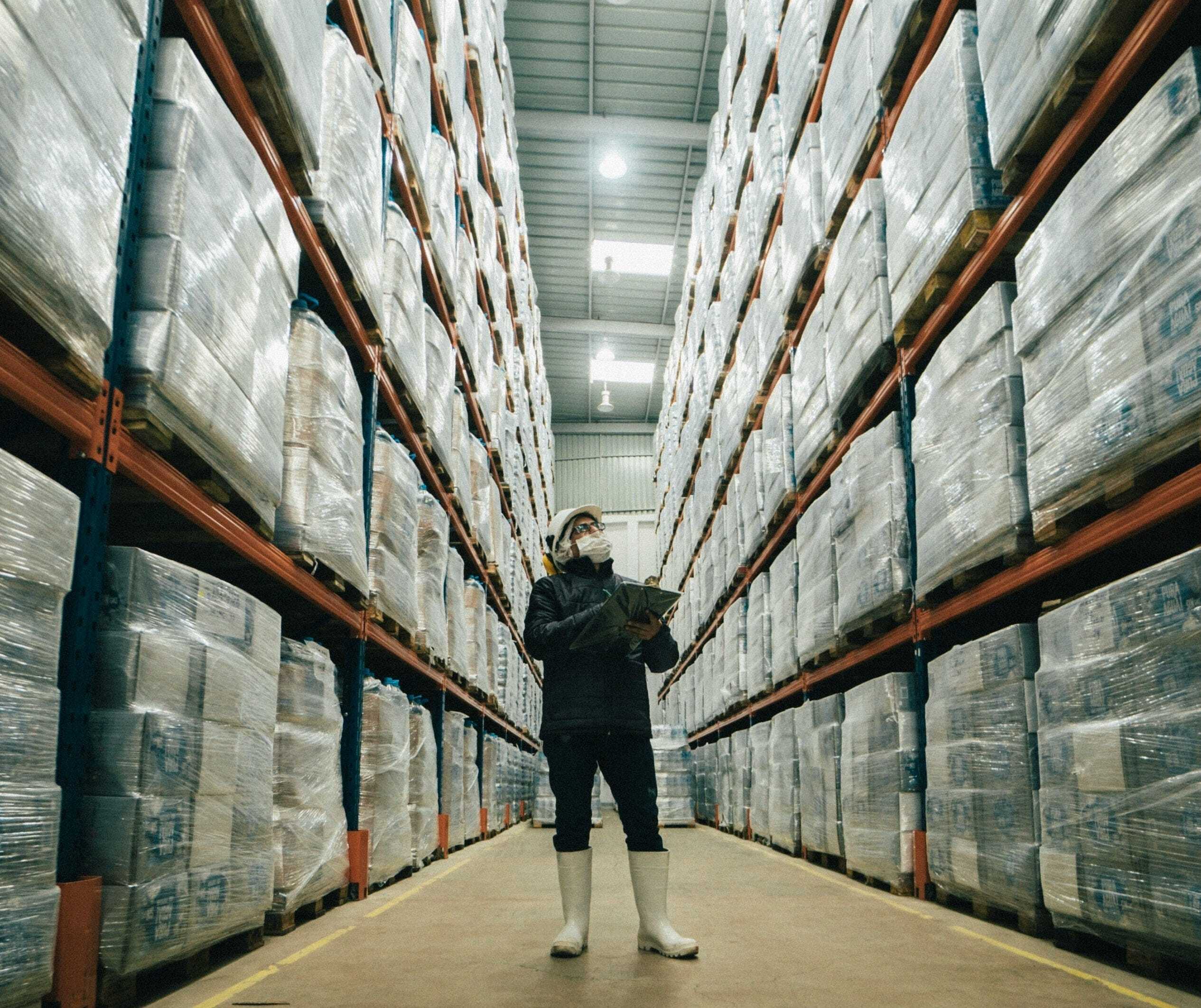 Header image: person taking inventory in a warehouse