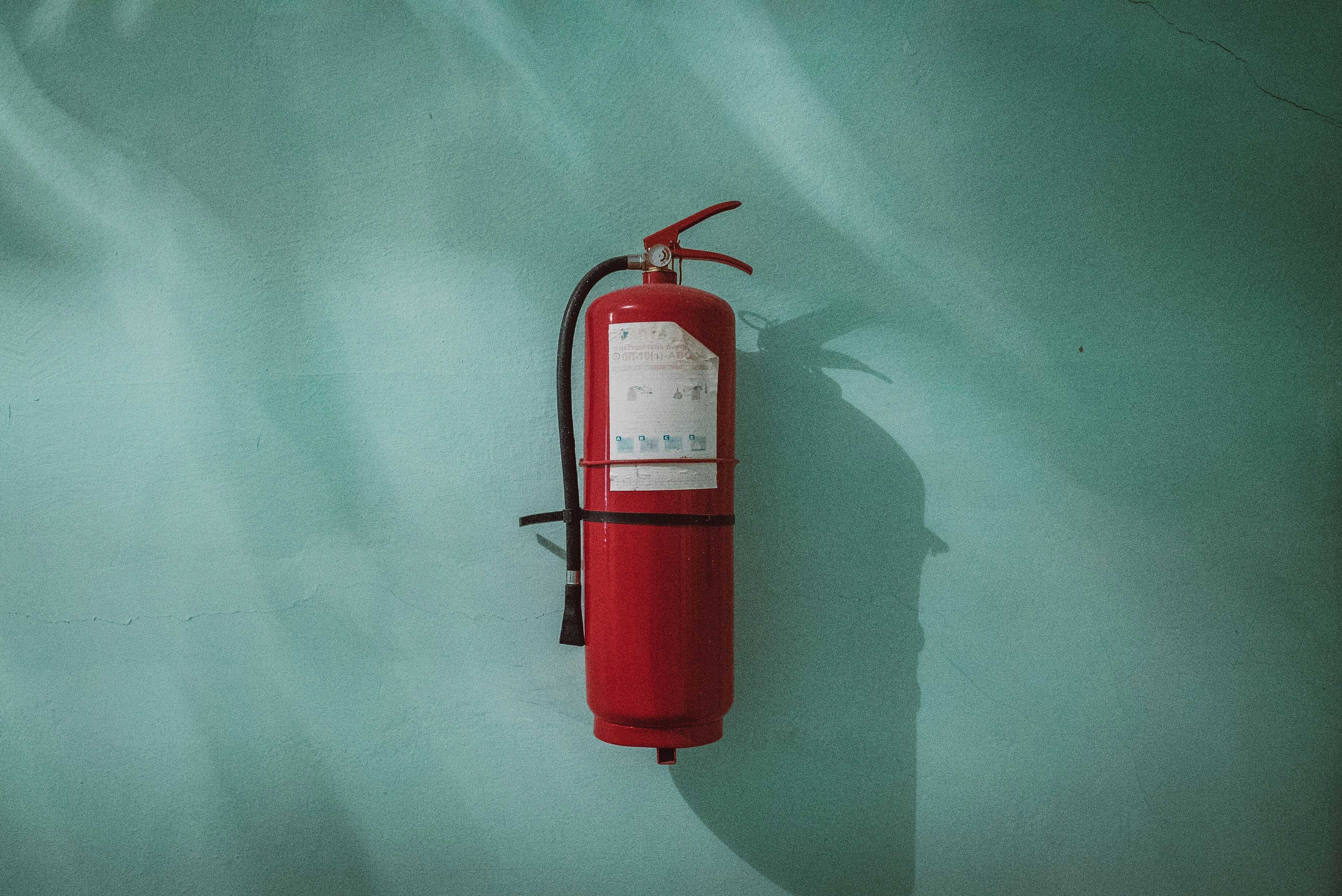 Header image: fire extinguisher hanging on a wall